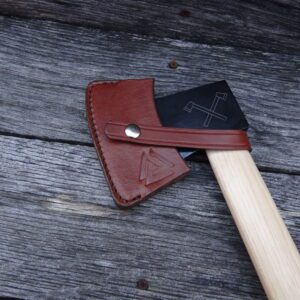 A wooden handle with an ax on top of it.