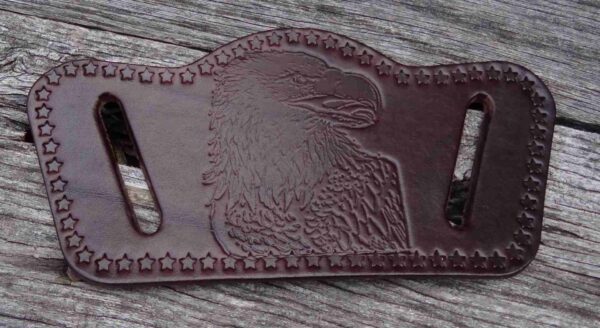 A brown leather wallet with an eagle on it.