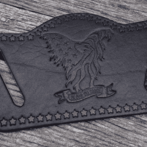 A black leather belt with an eagle on it.