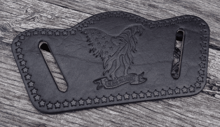 A black leather belt with an eagle on it.