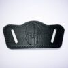 A black leather belt with a spartan helmet on it.