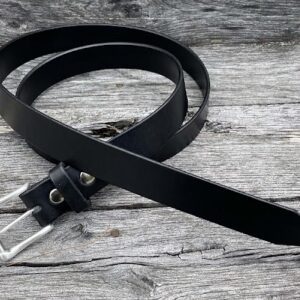 A black belt laying on top of a wooden table.