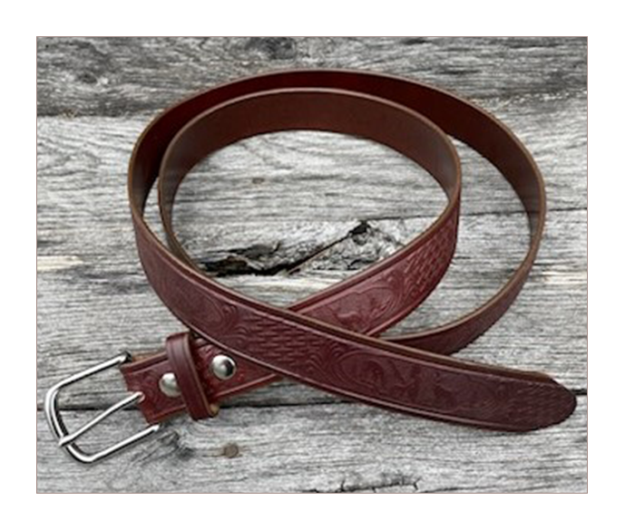 A brown leather belt sitting on top of a wooden table.