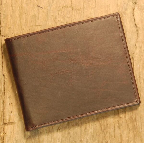 A brown wallet sitting on top of a wooden table.